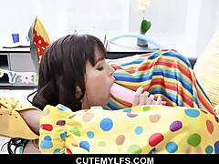 Pretty milf gives a blowjob to a clown